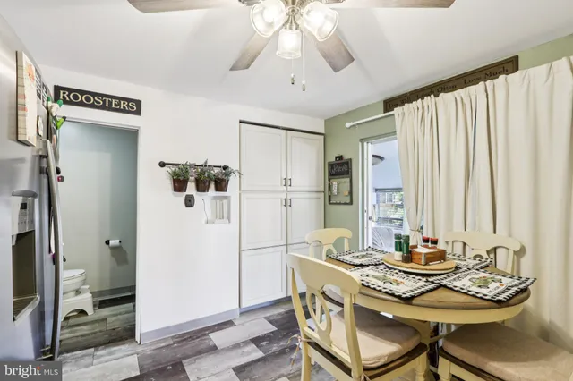 a dining room with furniture and window