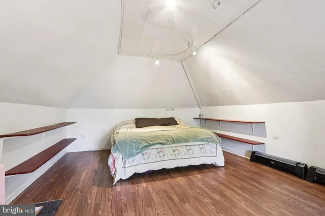 a bedroom with a bed and a chair