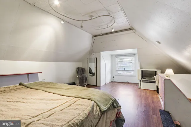 a living room with lots of furniture and white walls