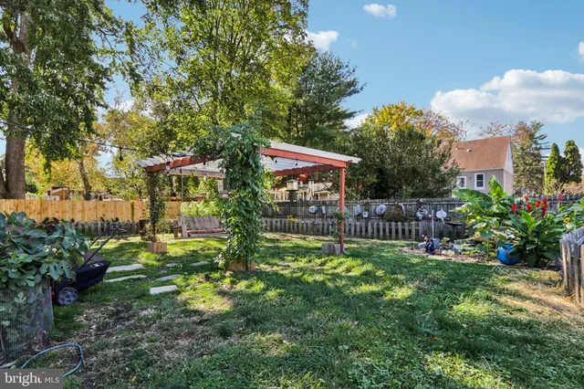 a view of a house with wooden fence