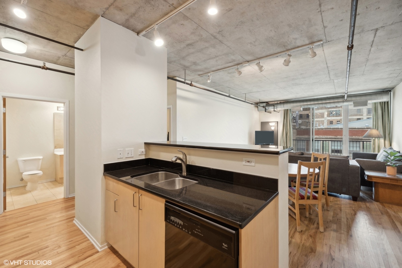 700 West Van Buren Street, Unit 1002 Chicago, IL 60607 - Photo 12 of 18 a kitchen that has a sink and a stove in it