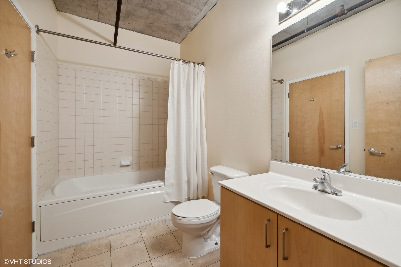 700 West Van Buren Street, Unit 1002 Chicago, IL 60607 - Photo 15 of 18 a bathroom with a sink toilet and shower