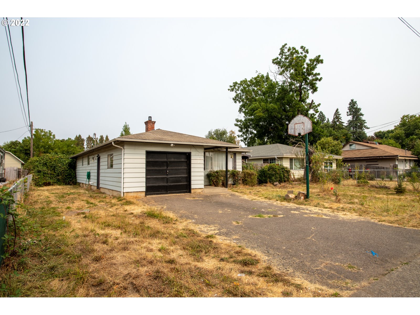 2364 G Street Springfield, OR 97477 - Photo 3 of 15 a front view of a house with a yard and garage