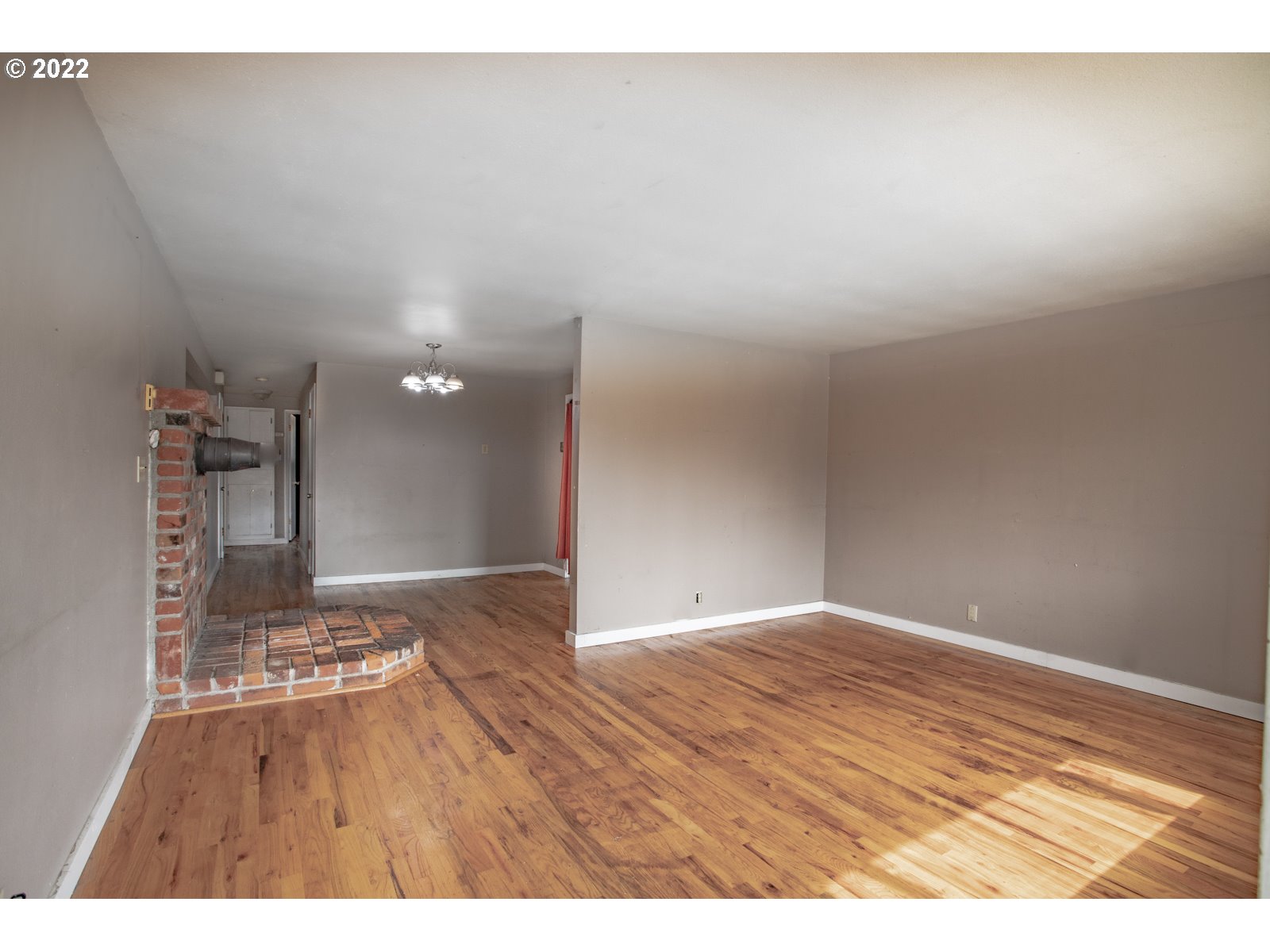 2364 G Street Springfield, OR 97477 - Photo 4 of 15 a view of an empty room and wooden floor