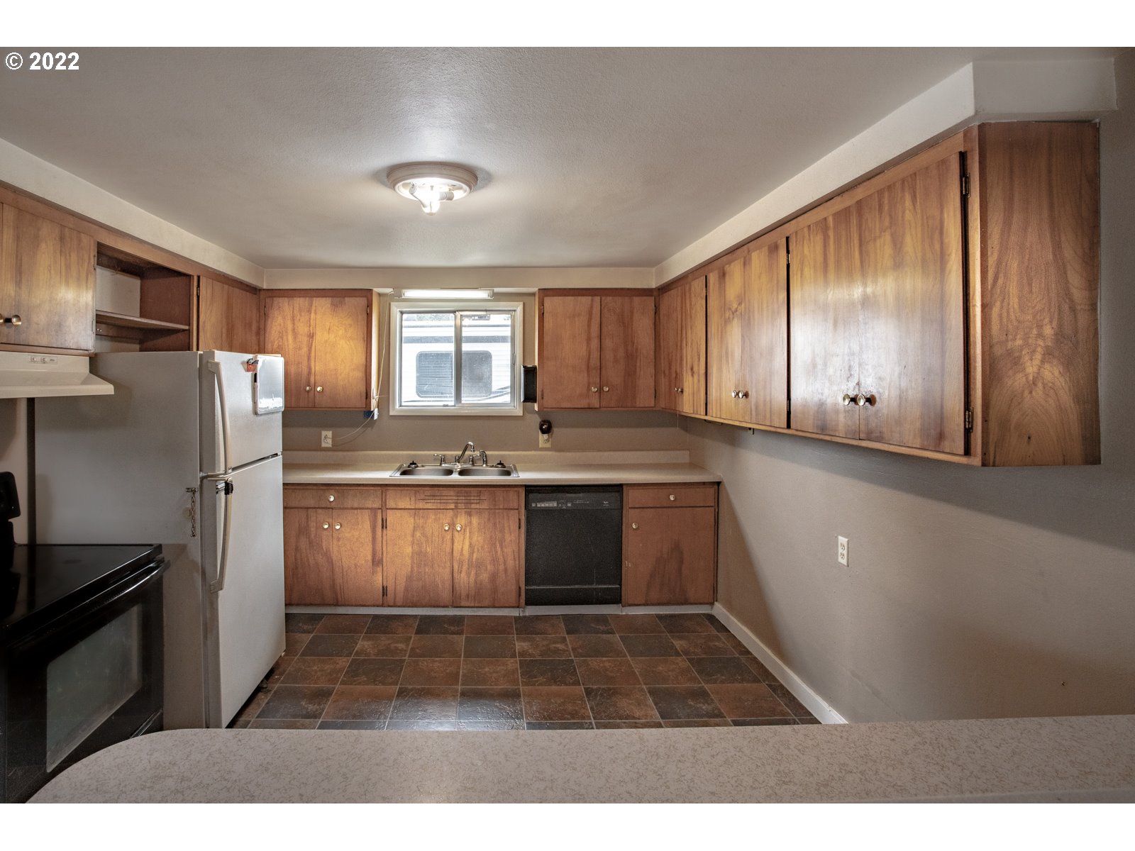 2364 G Street Springfield, OR 97477 - Photo 8 of 15 a kitchen with a refrigerator and a sink