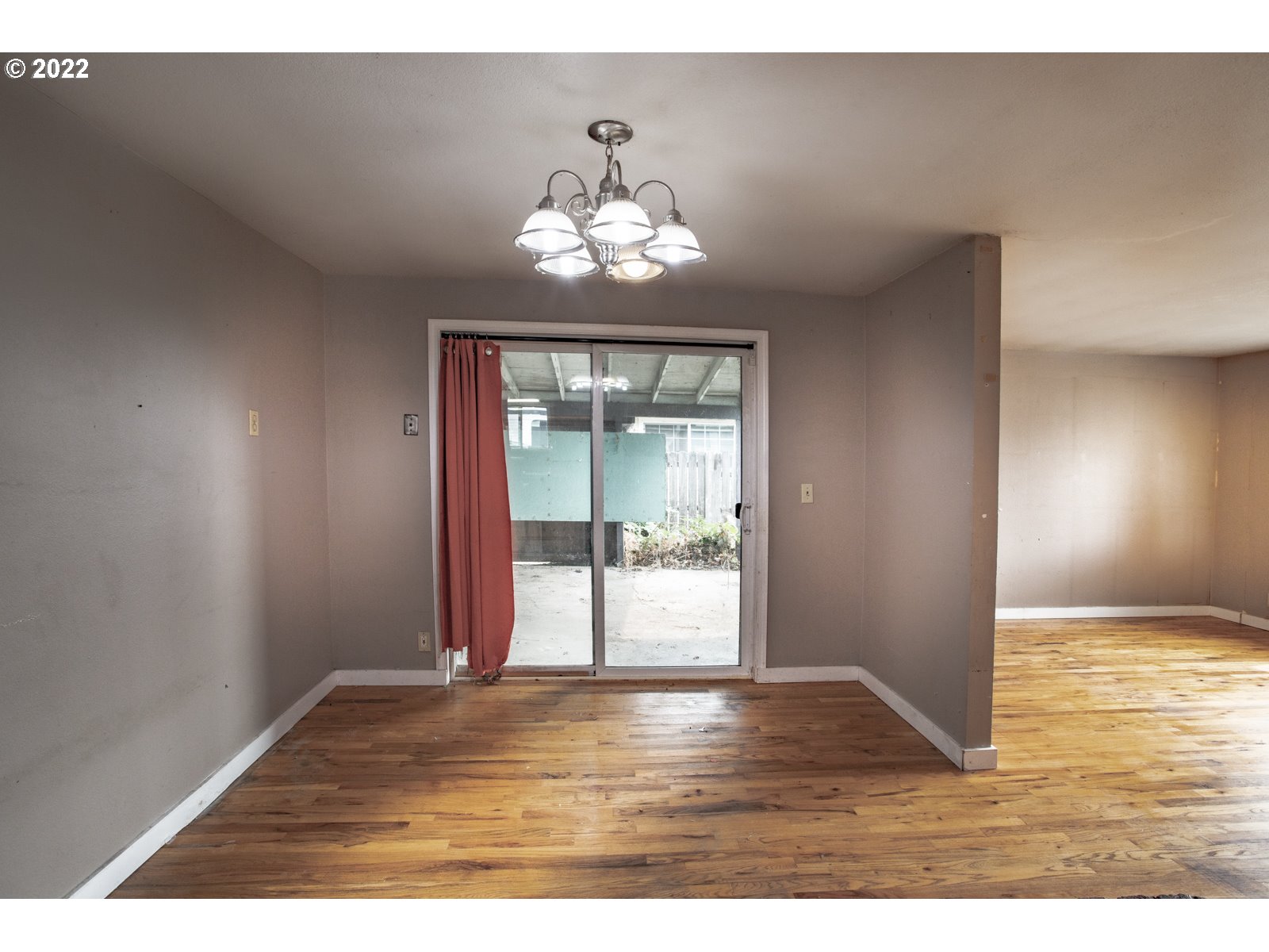 2364 G Street Springfield, OR 97477 - Photo 10 of 15 a view of an empty room with wooden floor and a window