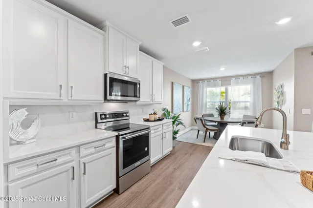 a view of a house with a yard and garage