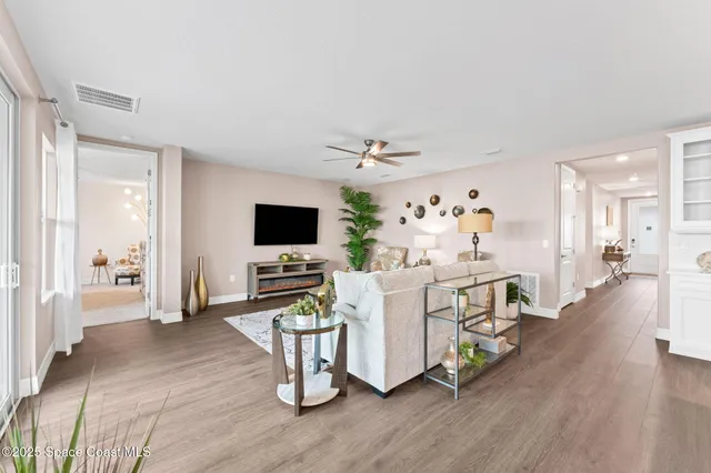 an empty room with a ceiling fan and a ceiling fan