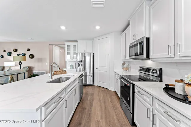 a bedroom with bed and ceiling fan