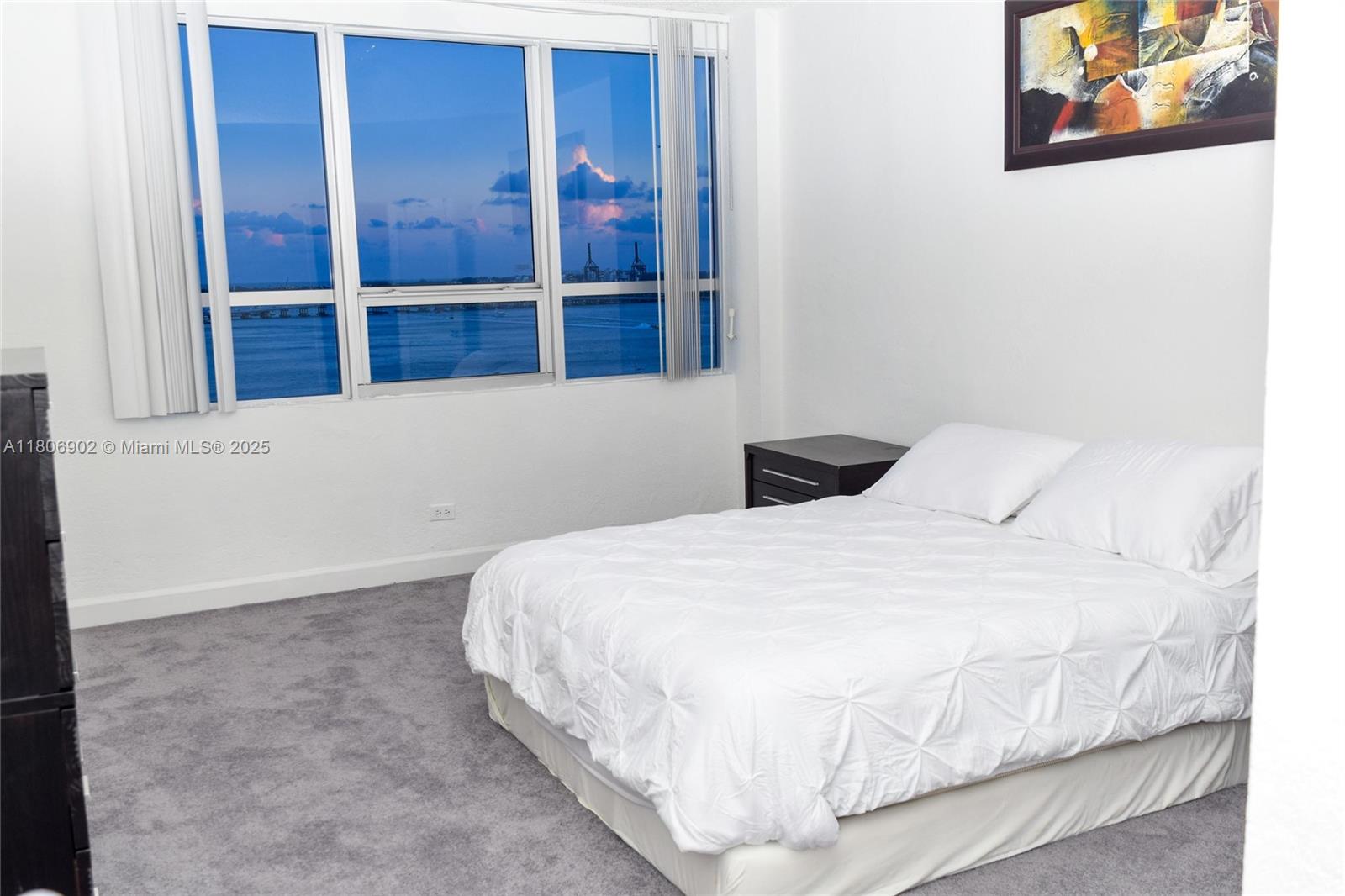 1500 Bay Road, Unit 1532S Miami Beach, FL 33139 - Photo 20 of 50 a bedroom with a bed and window