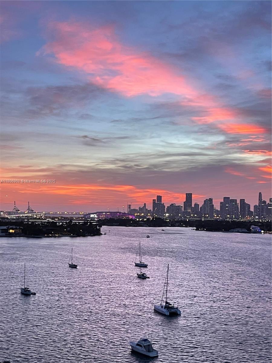 1500 Bay Road, Unit 1532S Miami Beach, FL 33139 - Photo 31 of 50 a view of a lake with sunset in the background