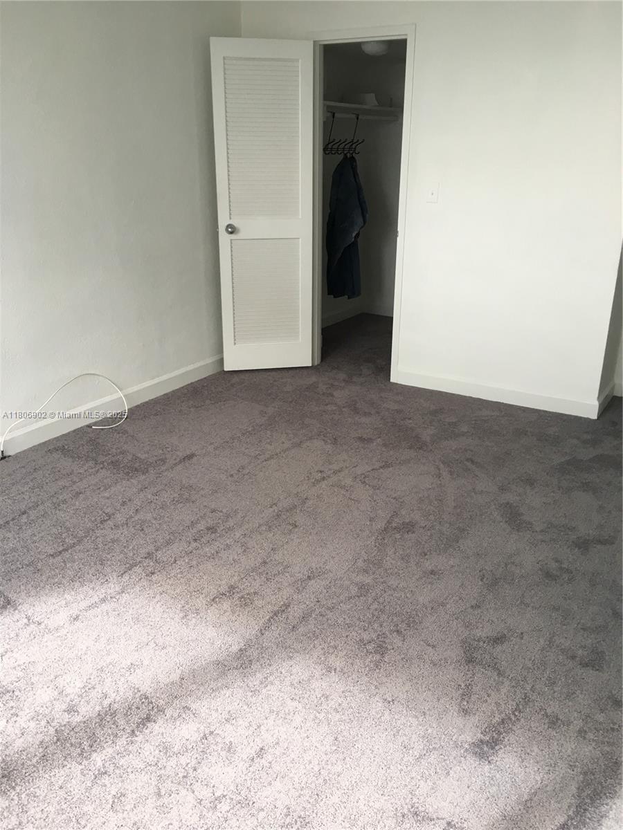 1500 Bay Road, Unit 1532S Miami Beach, FL 33139 - Photo 40 of 50 a view of a room with a hallway and toilet