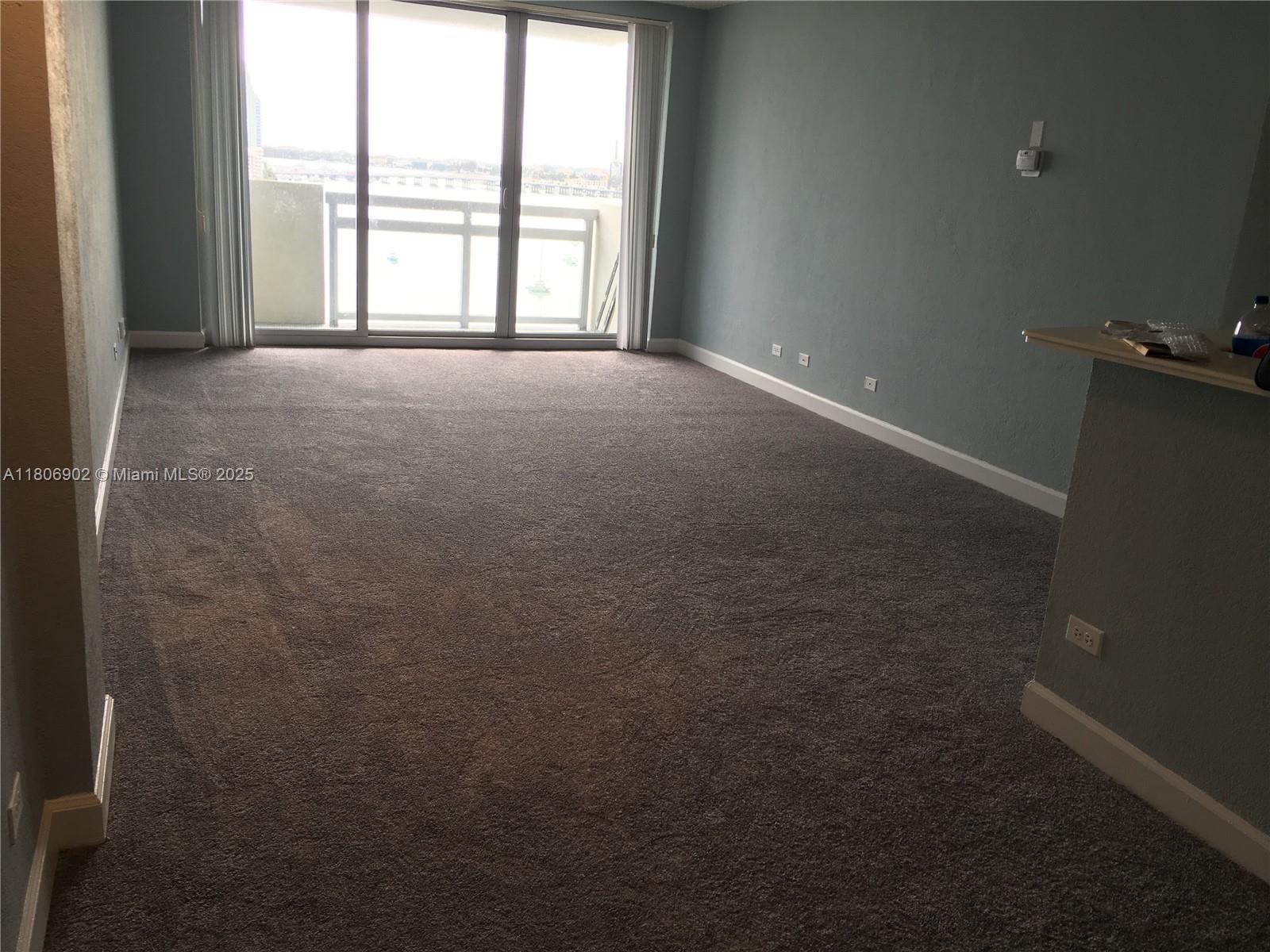 1500 Bay Road, Unit 1532S Miami Beach, FL 33139 - Photo 42 of 50 an empty room with a empty space and a window