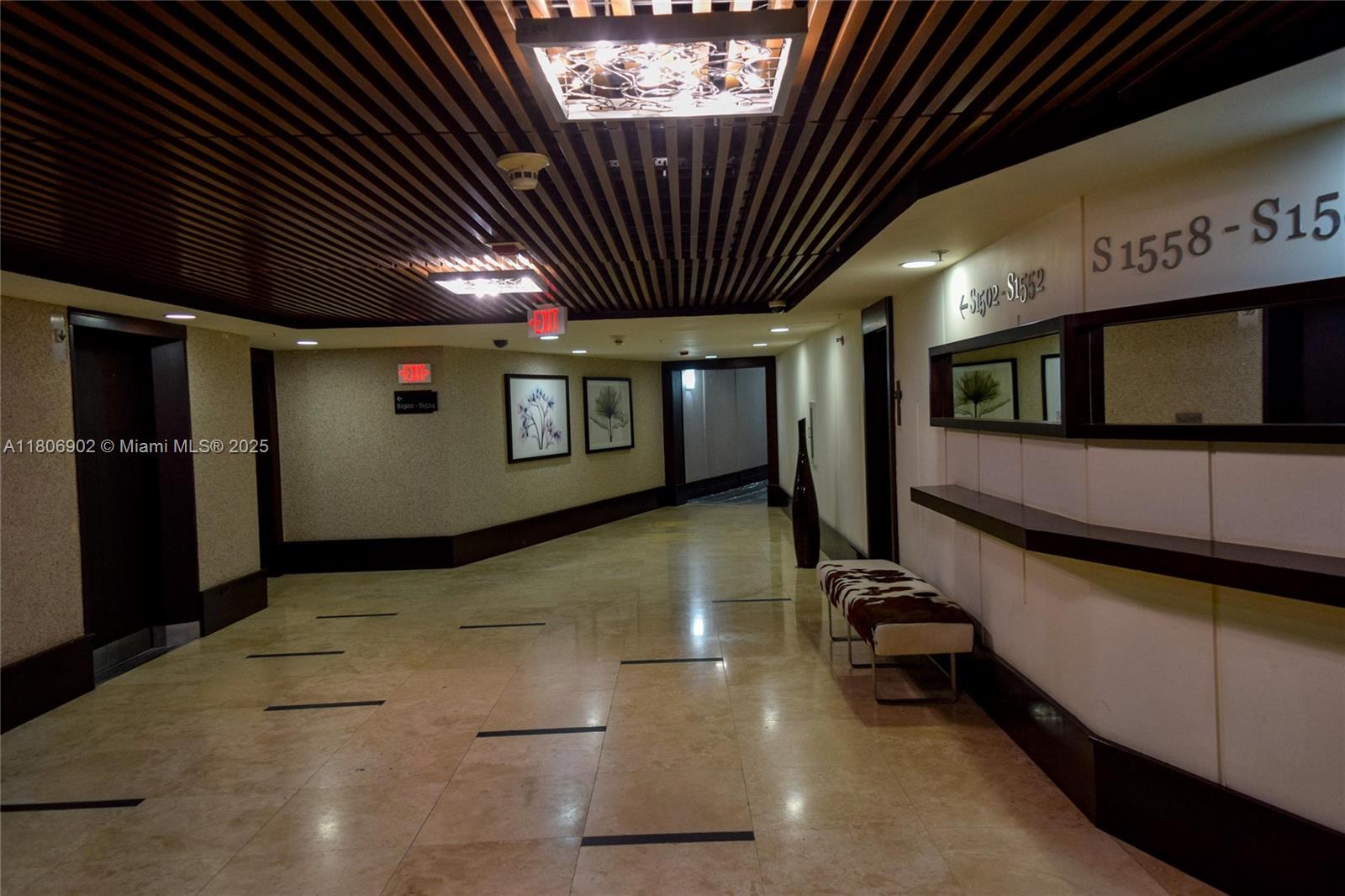 1500 Bay Road, Unit 1532S Miami Beach, FL 33139 - Photo 8 of 50 a view of a hall with tv