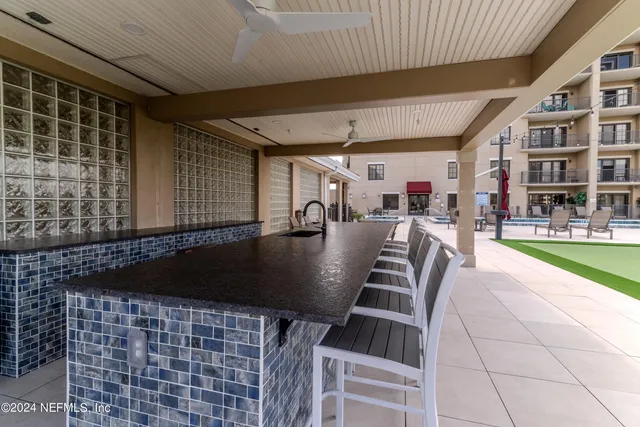 a view of a hall with couches