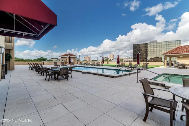 a outdoor space with lots of table and chairs