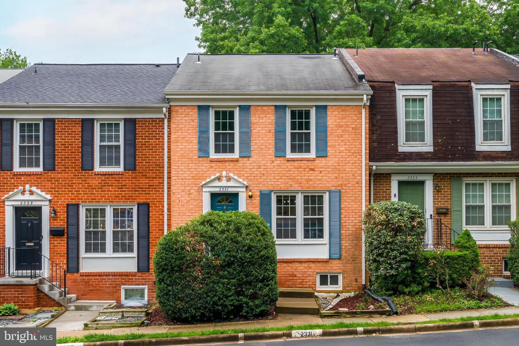 2331 Harleyford Court Reston, VA 20191 - Photo 2 of 40 Charming brick home with lush greenery.