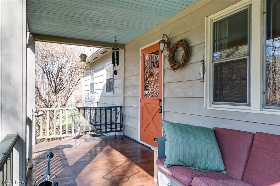 9790 Wilson Mills Road Chardon, OH 44024 - Photo 2 of 33 Relax on your inviting covered deck! Great flooring and room to sit and ponder....
