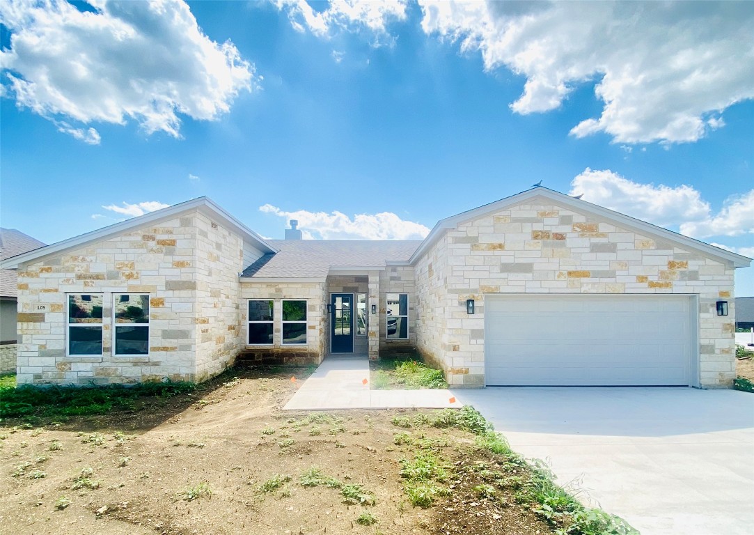 a view of a white house with a yard