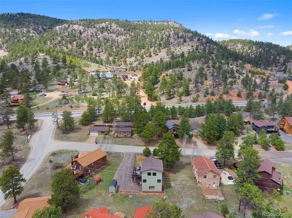 an aerial view of house with yard