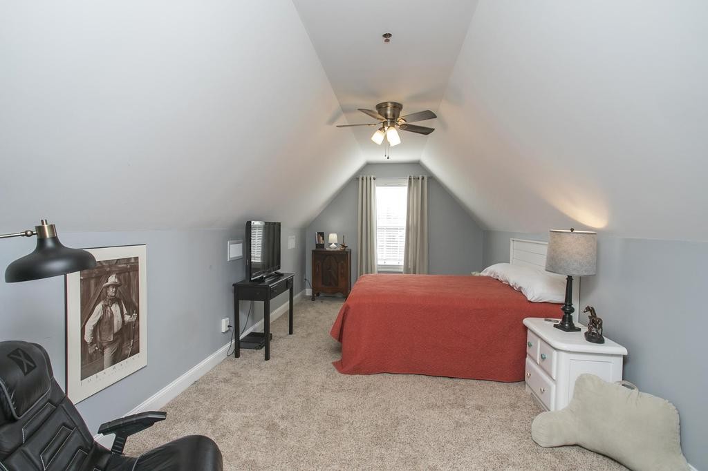 110 Edgewater Falls Murfreesboro, TN 37129 - Photo 19 of 31 a bedroom with a bed and a chandelier