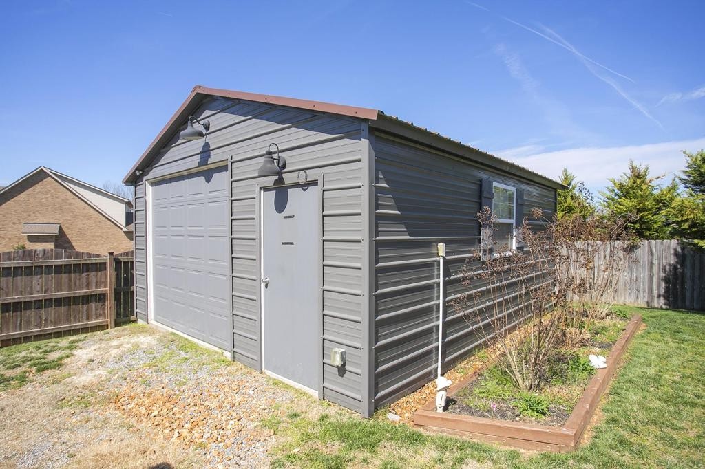 110 Edgewater Falls Murfreesboro, TN 37129 - Photo 24 of 31 a view of house with a large window and wooden fence