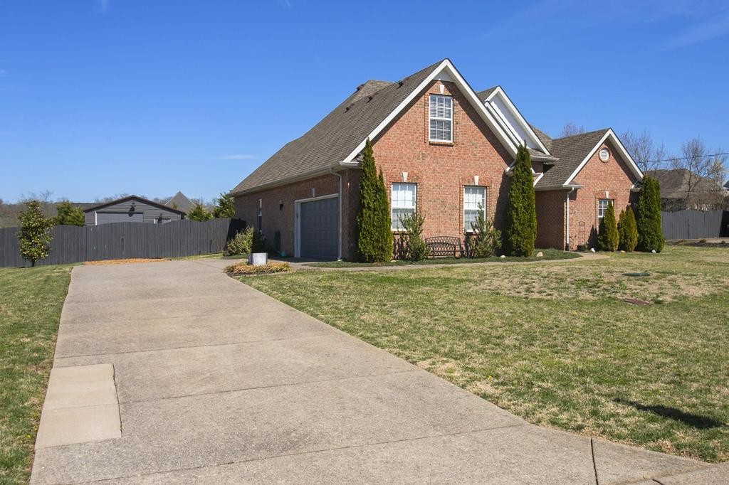 110 Edgewater Falls Murfreesboro, TN 37129 - Photo 3 of 31 a front view of a house with a yard