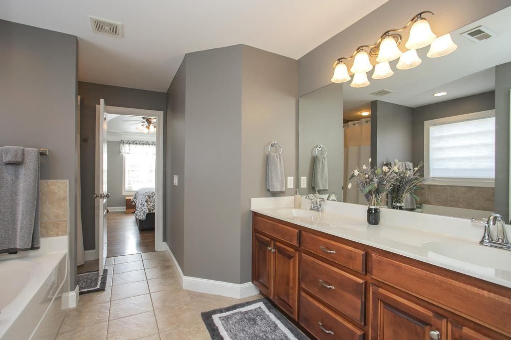110 Edgewater Falls Murfreesboro, TN 37129 - Photo 8 of 31 a bathroom with a sink a large mirror and a shower