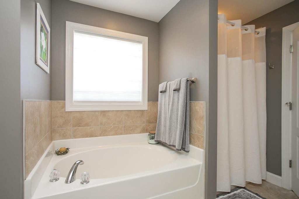 110 Edgewater Falls Murfreesboro, TN 37129 - Photo 9 of 31 a white bath tub sitting next to a shower