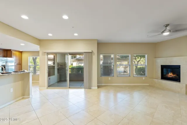 a kitchen with granite countertop a sink and a large mirror
