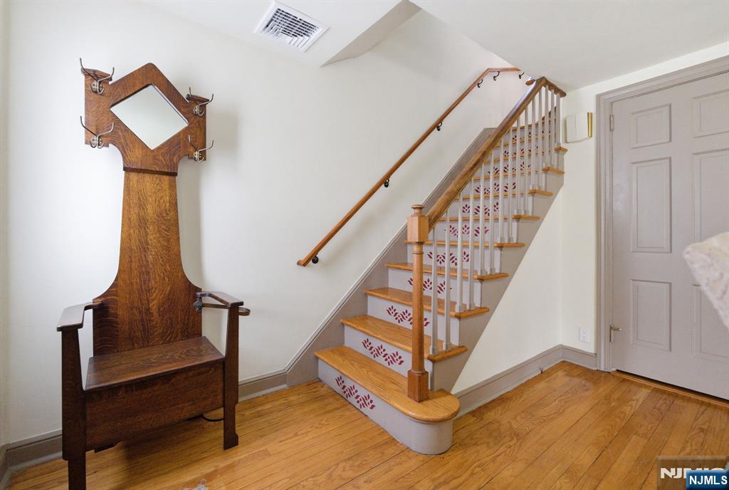 34 Espy Road Caldwell, NJ 07006 - Photo 11 of 25 a view of entryway with wooden floor and stairs