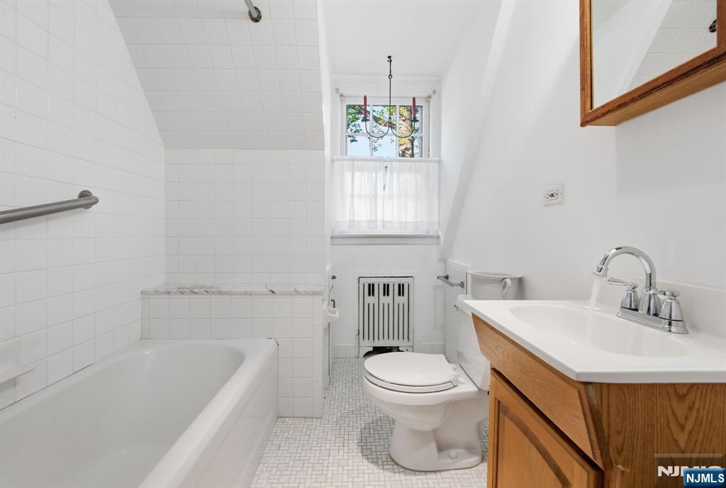34 Espy Road Caldwell, NJ 07006 - Photo 13 of 25 a bathroom with a sink a toilet and bathtub