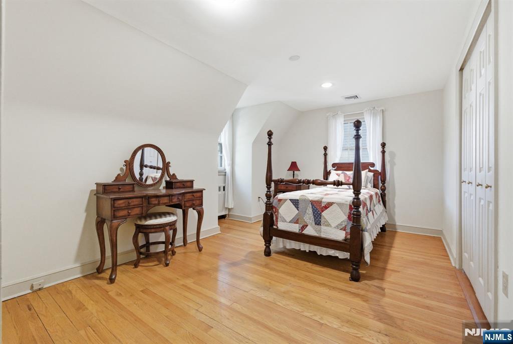 34 Espy Road Caldwell, NJ 07006 - Photo 14 of 25 a bedroom with a bed and a dresser