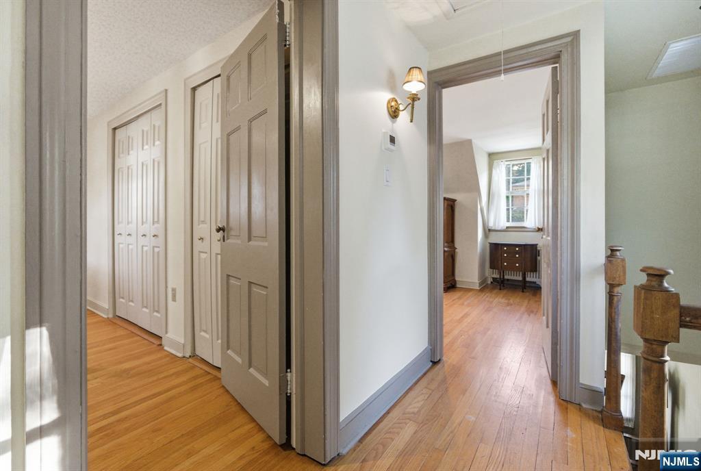 34 Espy Road Caldwell, NJ 07006 - Photo 15 of 25 a view of a hallway with wooden floor and closet
