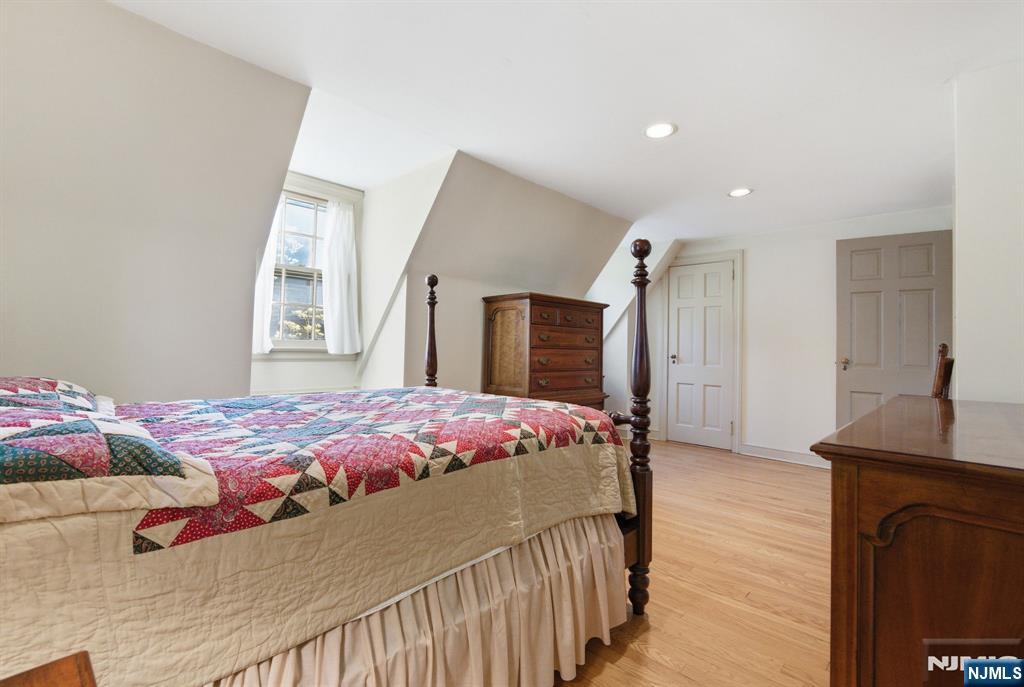 34 Espy Road Caldwell, NJ 07006 - Photo 17 of 25 a bedroom with a bed and a flat screen tv