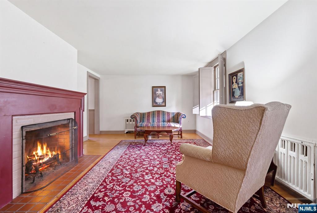 34 Espy Road Caldwell, NJ 07006 - Photo 5 of 25 a living room with furniture and a fireplace