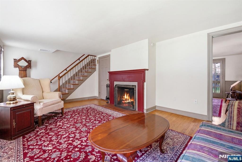 34 Espy Road Caldwell, NJ 07006 - Photo 7 of 25 a living room with furniture and a fireplace