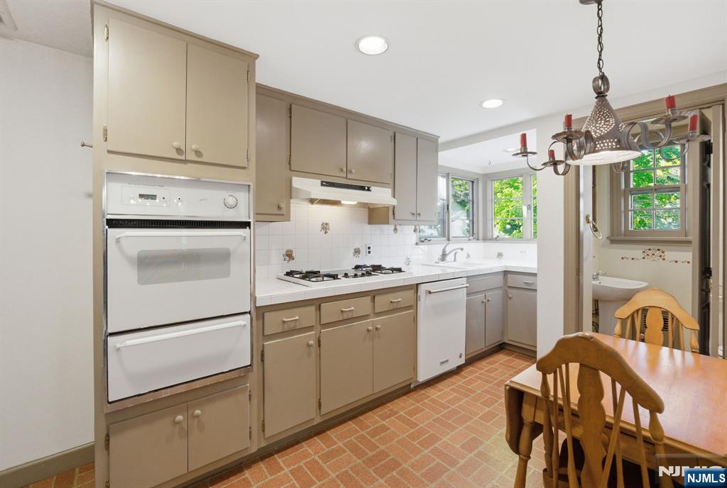34 Espy Road Caldwell, NJ 07006 - Photo 9 of 25 a kitchen with a refrigerator and a sink