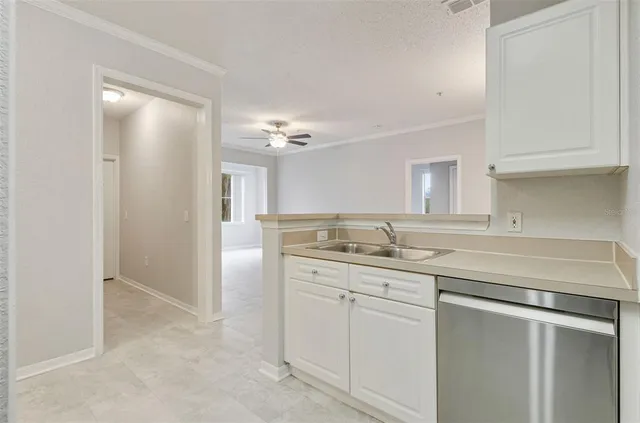 a kitchen with a sink and cabinets