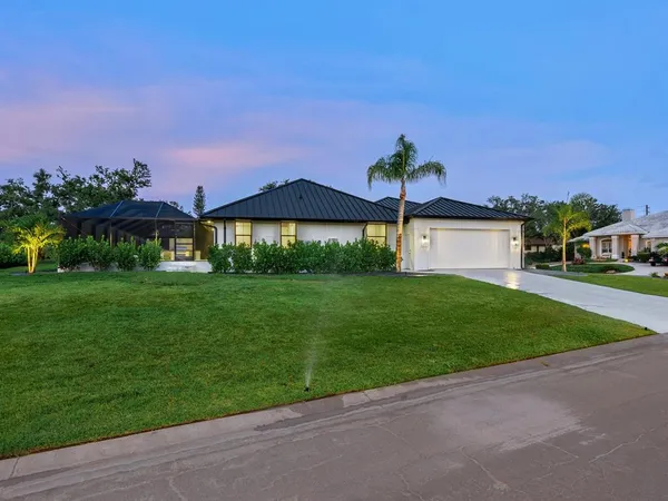 a dining room with furniture window and wooden floor