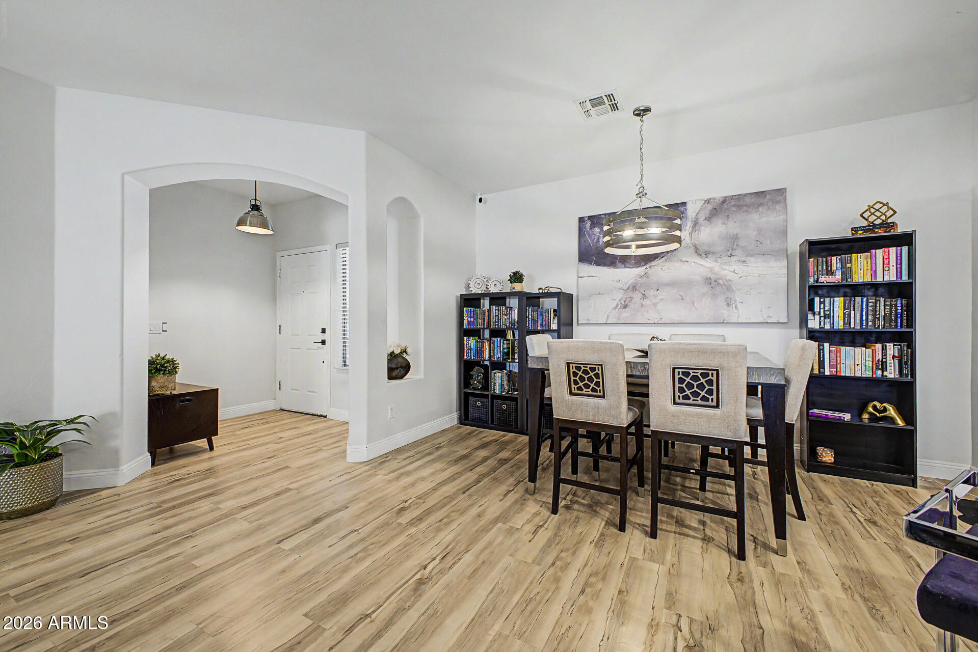 4924 West Harwell Road Laveen, AZ 85339 - Photo 8 of 27 a dining room with furniture and wooden floor