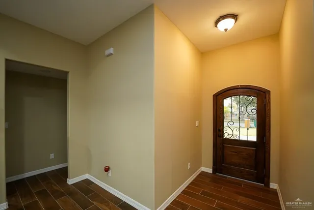 a view of an entryway with wooden floor