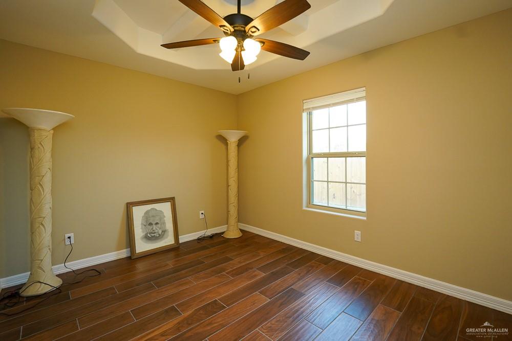 1408 Royola Street Mission, TX 78572 - Photo 28 of 42 a view of an empty room with window and wooden floor