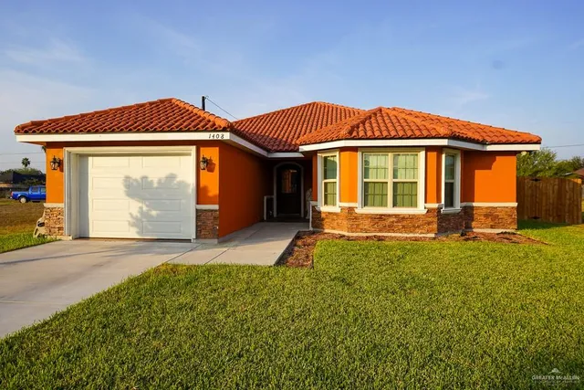a front view of a house with yard