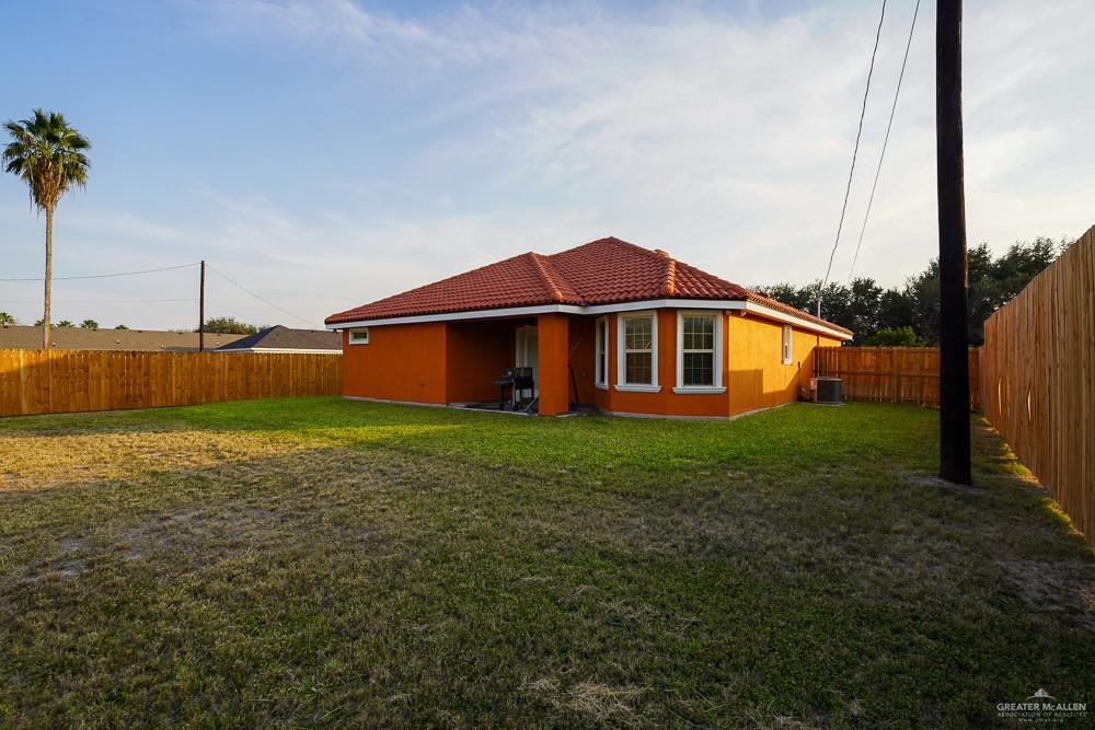 1408 Royola Street Mission, TX 78572 - Photo 31 of 42 a view of a house with a yard