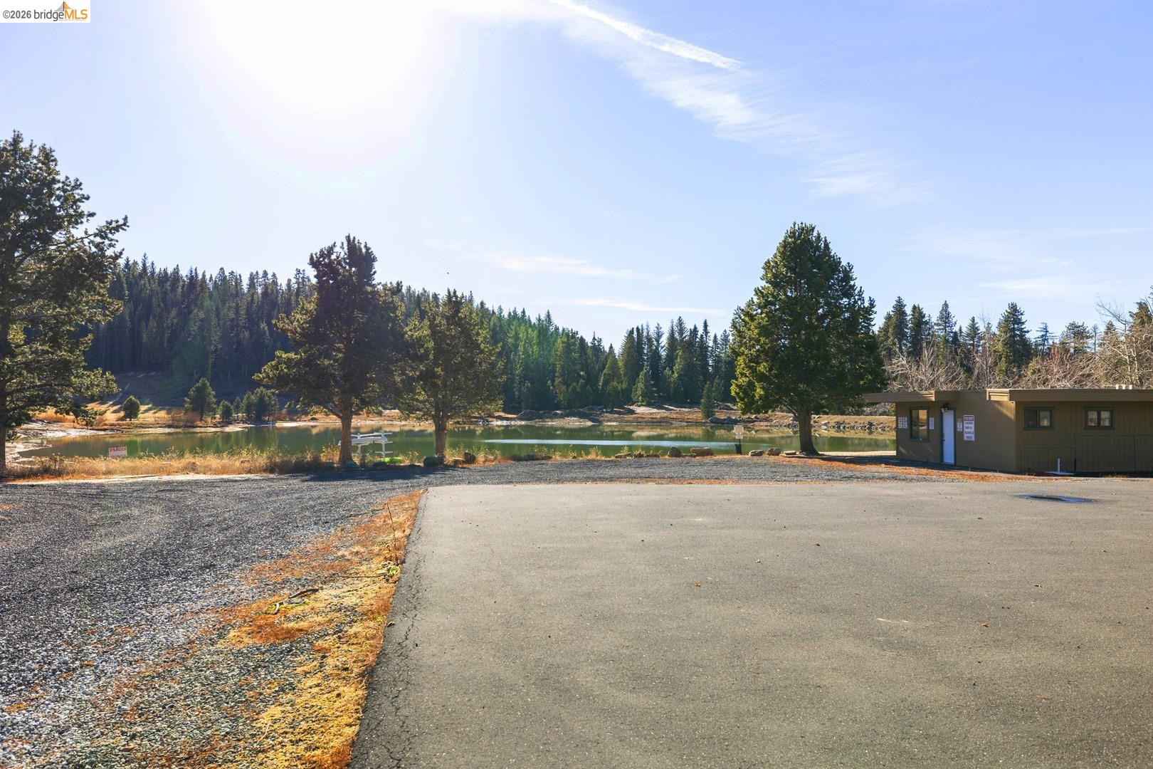 33840 Upper Leland Road, Unit 25A Pinecrest, CA 95364 - Photo 36 of 41 a backyard of a house with table and chairs