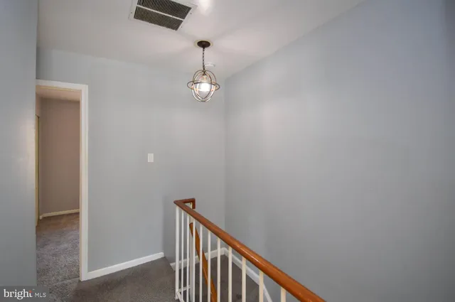 a view of a hallway with a window