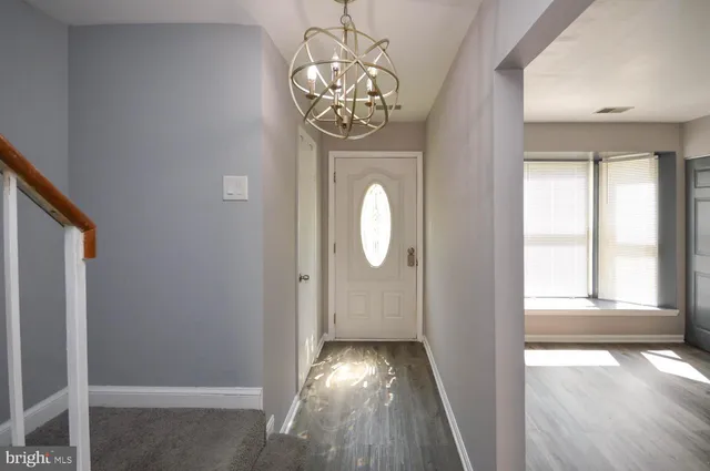 a view of gallery with wooden floor