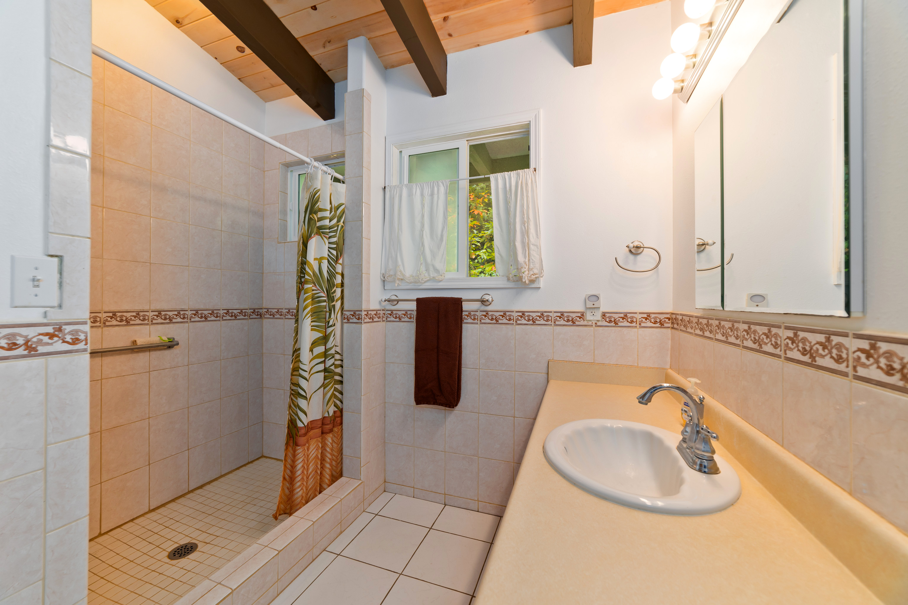44-3342 Kula Kahiko Road Paauilo, HI 96776 - Photo 14 of 30 a bathroom with a granite countertop sink a mirror and vanity