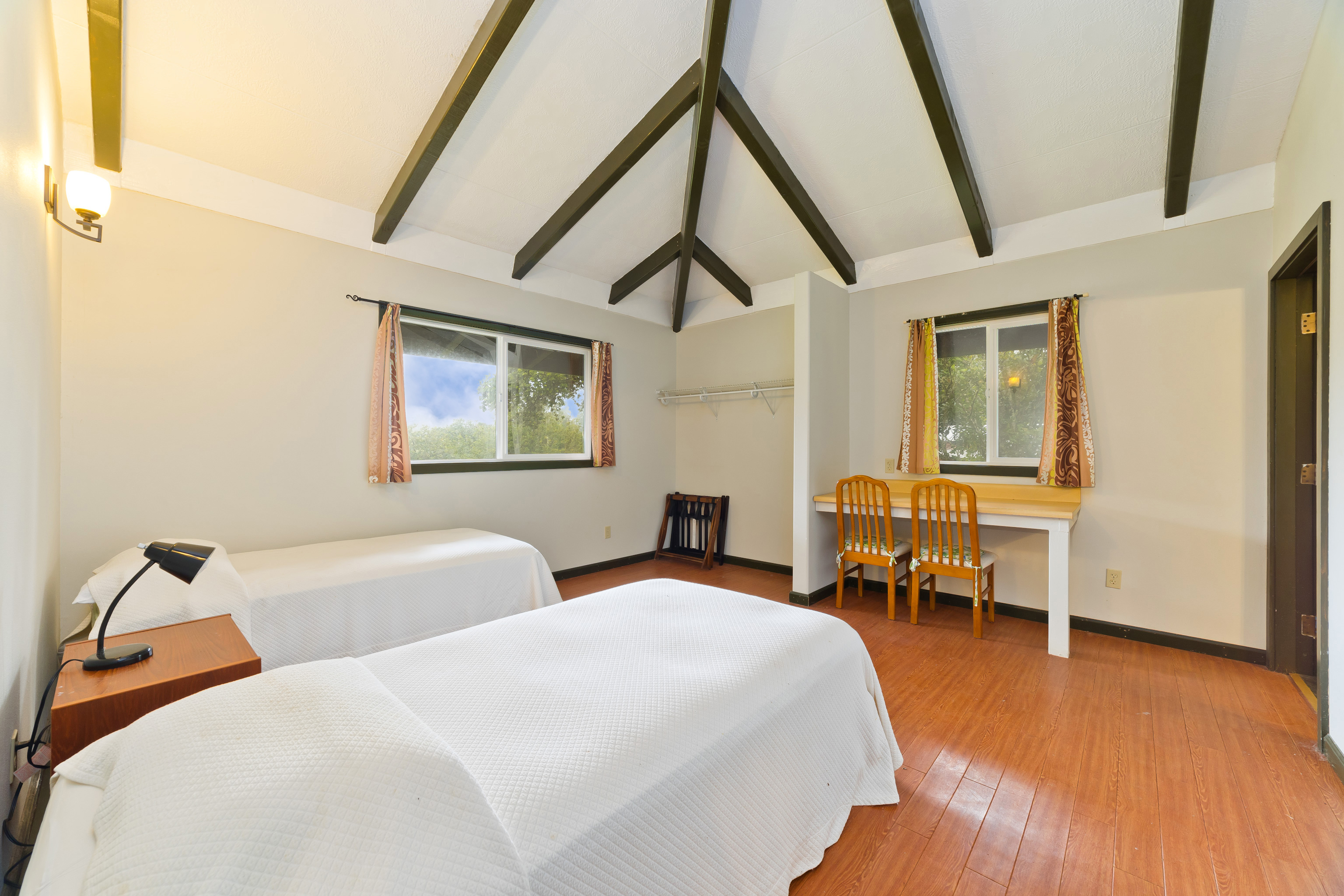 44-3342 Kula Kahiko Road Paauilo, HI 96776 - Photo 19 of 30 a bedroom with two beds and wooden floor